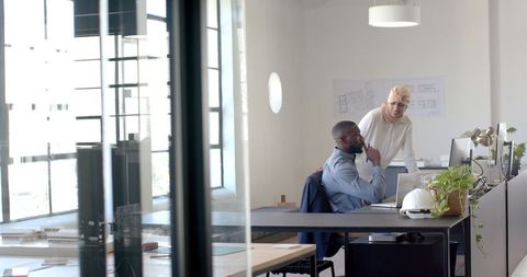 Diverse Team Collaborating on Technical Project in Modern Office - Download Free Stock Images Pikwizard.com