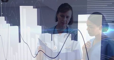 Healthcare professionals analyzing medical data with digital graphs