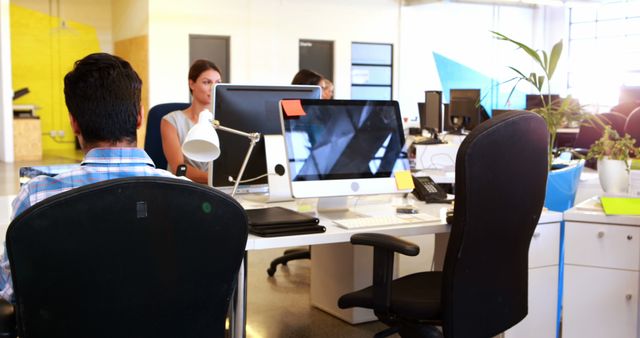 Modern Open Office with Focused Workers at Desks - Download Free Stock Images Pikwizard.com