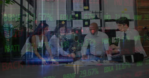 Diverse Team Analyzing Financial Data Overlaid with Digital Information