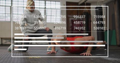 Man performing push-ups while trainer coaching, augmented hud fitness data overlay