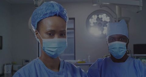 Confident Surgeons Poised in Modern Operating Room