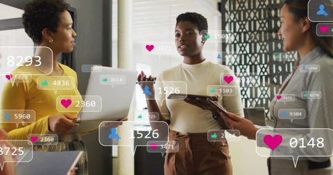 Female Leader Presenting Engagement Metrics with Tablet and Laptop, Social Media Overlays