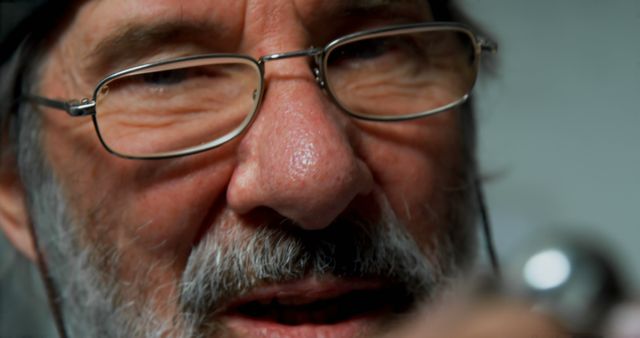 Close-Up of Elderly Man with Beard and Glasses - Download Free Stock Images Pikwizard.com