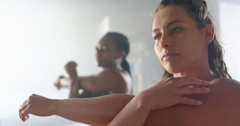 Women Warming Up in Gym Preparing for Intensive Workout