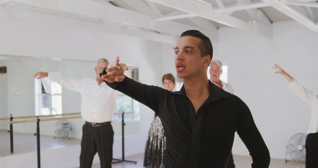 Young Latin Dance Instructor Teaching Senior Class in Studio - Download Free Stock Images Pikwizard.com