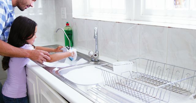 Father and Daughter Washing Dishes Together in Modern Kitchen - Download Free Stock Images Pikwizard.com