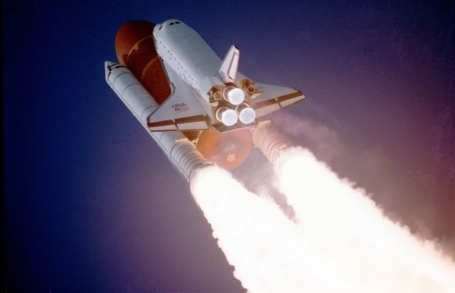 Space Shuttle Launching into Clear Sky with Powerful Boosters - Download Free Stock Photos Pikwizard.com