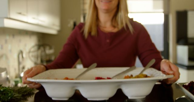 Woman Holding Tray of Vegetables in Kitchen - Download Free Stock Images Pikwizard.com