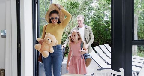 happy family returning home after summer vacation - Download Free Stock Images Pikwizard.com