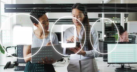 Diverse Team Engaged in Digital Discussion with Data Visualization