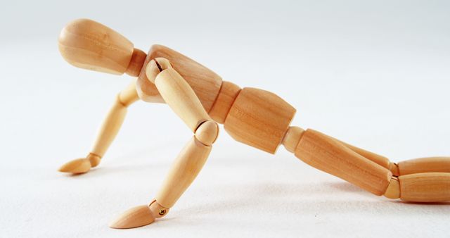 Wooden Mannequin Pushing Up on White Background - Download Free Stock Images Pikwizard.com