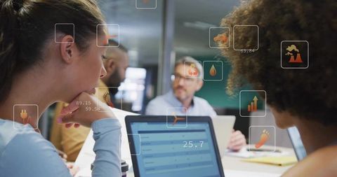 Team Collaborating in Office with Laptop and Augmented Reality Data Dashboards