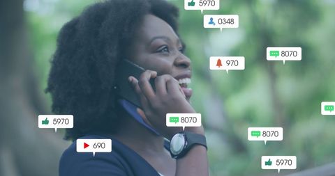 Joyful African American Woman Engaged on Smartphone with Social Media Icons