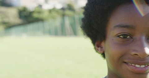 Happy Biracial Boy Outdoors with Sunshine Glow