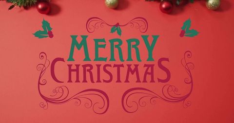 Two-color merry christmas typography with holly flourishes, garland and festive baubles