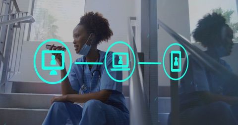 Smiling african american doctor communicating on smartphone with digital overlay