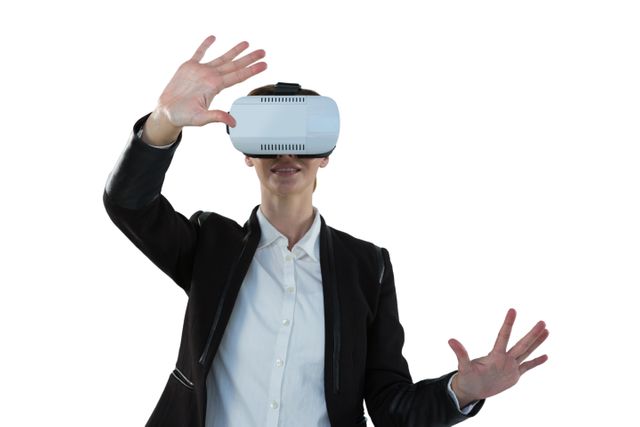 Businesswoman using virtual reality headset against white background