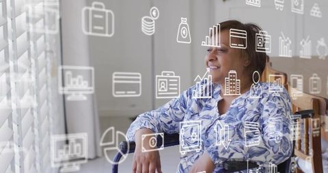 Senior woman in wheelchair looking out window smiling with floating data and health icons