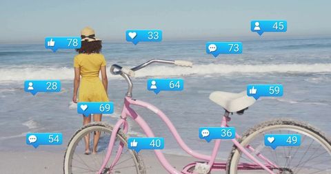 Woman on Beach with Pink Bicycle and Social Media Notifications