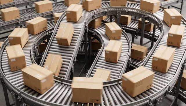 Curved conveyor system moving packed parcels through automated warehouse sorting lines