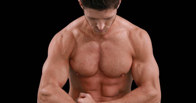 A muscular Caucasian man is showcased against a black background, with copy space - Download Free Stock Photos Pikwizard.com