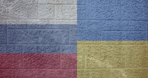 Intertwined Flags of Ukraine and Russia on Brick Background