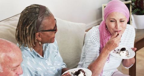 Seniors Enjoying Cake at Home Creating Joyful Gathering