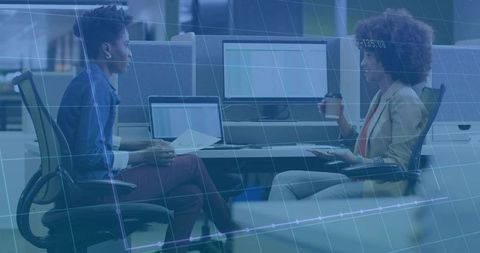 Two Colleagues Collaborating in Modern Open-Plan Office