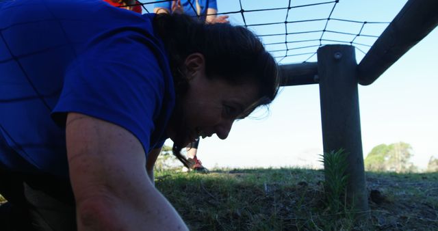 Woman Participating in Obstacle Course Challenge Outdoors - Download Free Stock Images Pikwizard.com