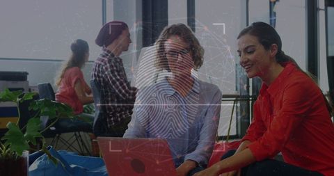 Businesswomen collaborating with biometric security overlay