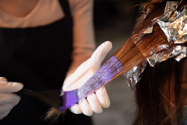 Hairdresser Coloring Hair with Purple Dye - Download Free Stock Photos Pikwizard.com