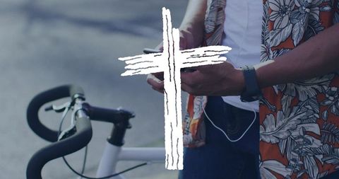 Urban Cyclist Checking Smartphone in Vibrant Attire