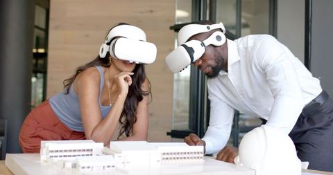 Colleagues Using Virtual Reality for Architectural Model Analysis