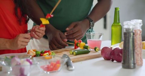 Friends sharing culinary creativity at kitchen counter