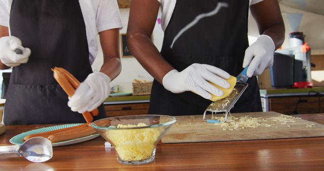 Hands Preparing Food in Kitchen with Safety Gloves - Download Free Stock Images Pikwizard.com