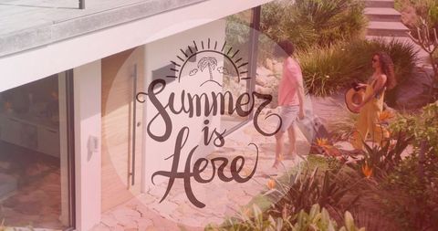 Couple walking to coastal home with luggage and summer script overlay