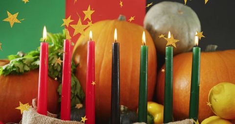 Kwanzaa candles with pumpkins celebrating unity and harvest