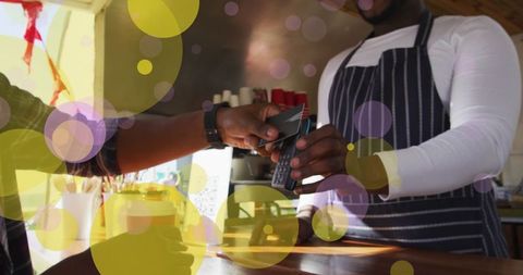 Contactless payment transaction at cafe counter