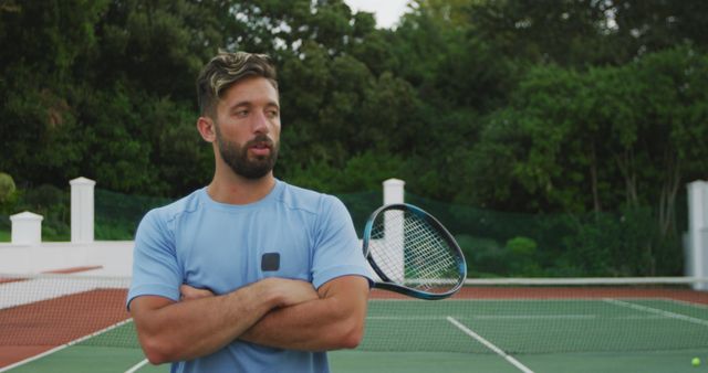 Male Tennis Player in Blue Shirt Standing Confidently Before Game - Download Free Stock Images Pikwizard.com