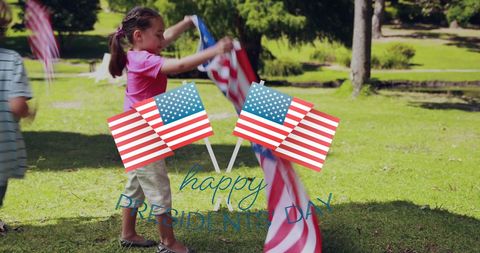 Children Celebrating Presidents Day with American Flags Outdoors