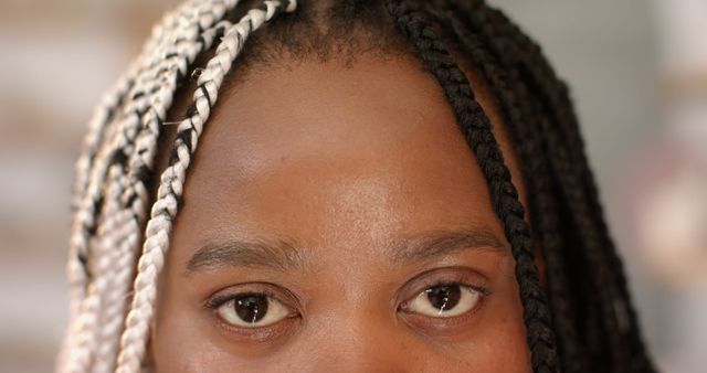 Eyes of african american woman with braids looking in pottery studio. Pottery, ceramics, handmade, local business, hobbies and craft, unaltered.