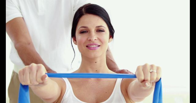 Woman at Physical Therapy Using Resistance Band with Physiotherapist - Download Free Stock Images Pikwizard.com