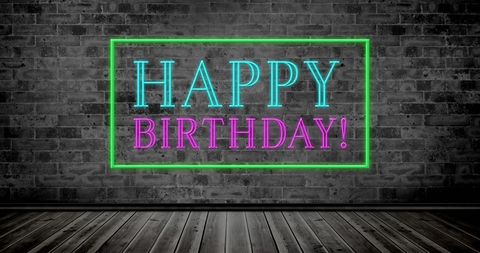Glowing Neon Happy Birthday Sign on Rustic Brick Wall