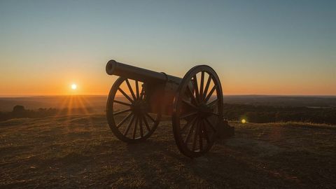 Historic Cannon on Hilltop at Sunset