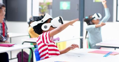 Children Engaged in Classroom VR Learning Experience