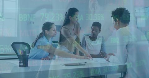 Diverse team analyzing data with future technology overlay