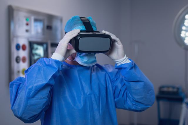 Depicts a male surgeon wearing a VR headset in an operating room, ideal for showcasing advancements in medical training and surgical procedures. Great for use in healthcare technology articles, medical training materials, and future medicine presentations.
