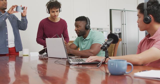 Young Multicultural Friends Recording Podcast at Table with Laptops and Microphones - Download Free Stock Images Pikwizard.com