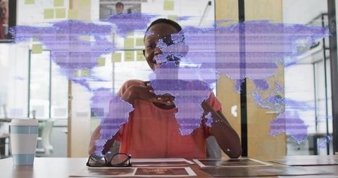 Professional presenting holographic world map during team office brainstorming session
